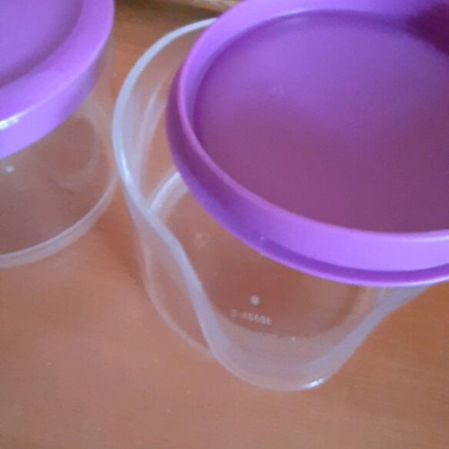 Tupperware product set new with collectible spatula and small cups