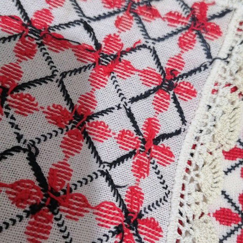 Large embroidered table runner used with handmade lace