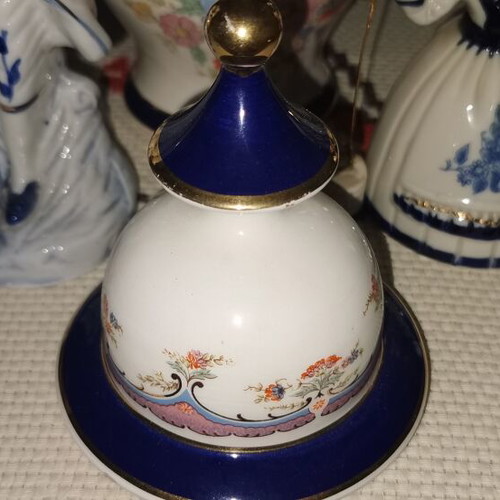 Vintage porcelain decorative set with lidded vase and 2 figurines, 3 pieces