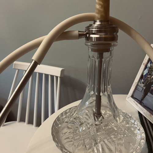 Hookah used with grill, tongs, coals, flavors, and cleaning set