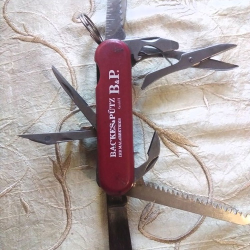 Multitool pocket knife like new, stainless steel with saw and scissors