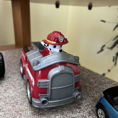 Toy cars, some unused, plastic and metal Mini Cooper