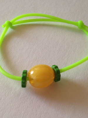 Bracelet light green with yellow bead used