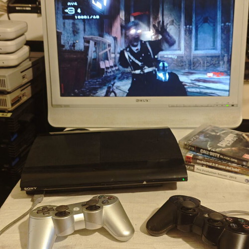 PlayStation 3 Super Slim console 1TB with controllers and games