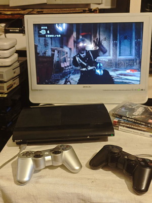 PlayStation 3 Super Slim console 1TB with controllers and games