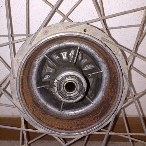 Motorcycle rim used, old with surface rust and missing spoke
