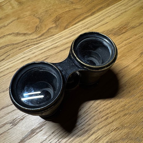 Vintage French binoculars used with leather covering good condition