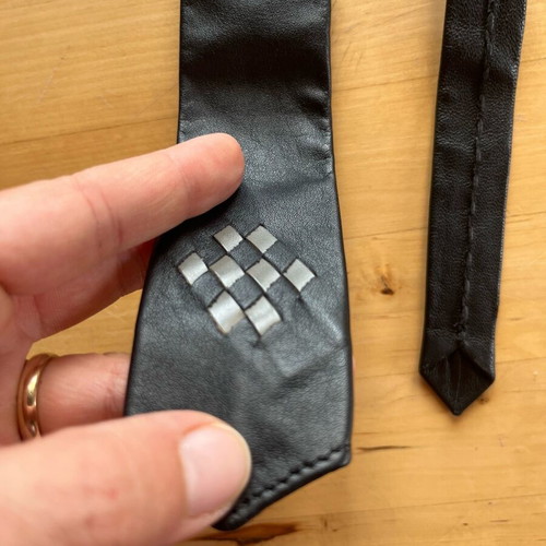 Leather black tie used with gray detail