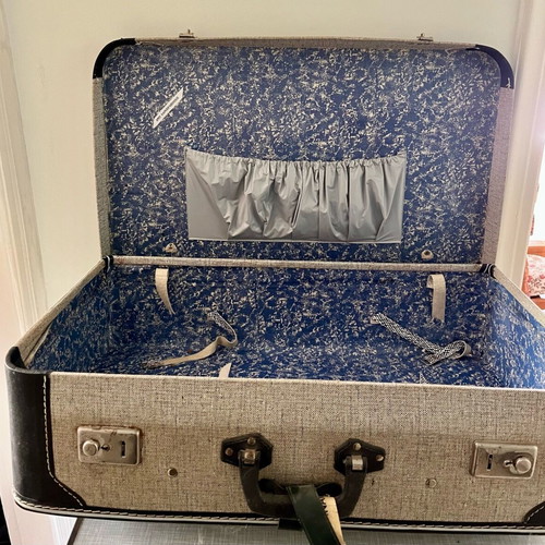 Retro travel suitcase used vintage with fabric lining