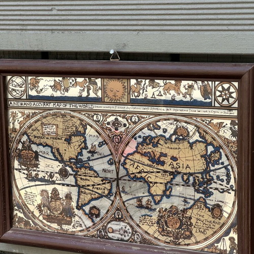 Decorative mirror with antique world map used, wooden frame