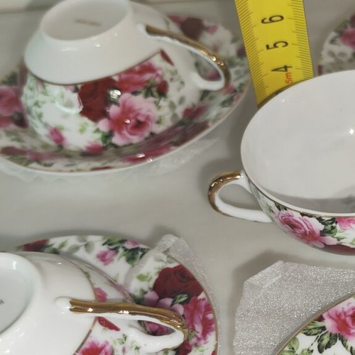 Vintage porcelain tea cups set with floral rose pattern and lithophany