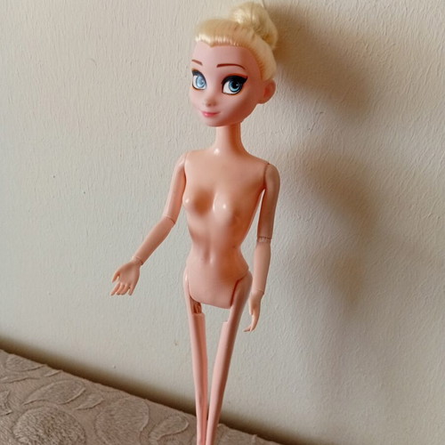 Elsa doll from Disney Frozen used, articulated arms