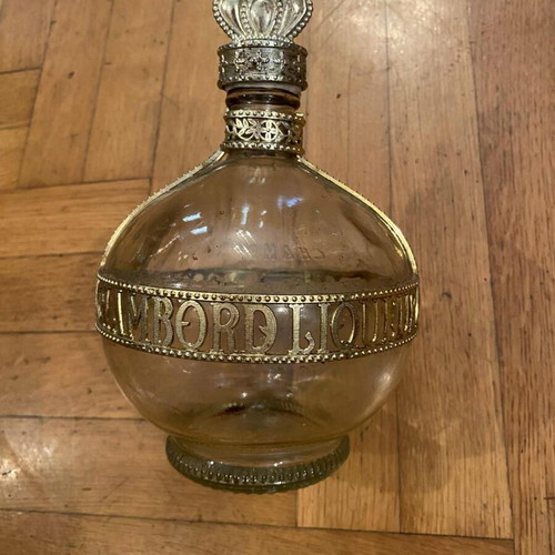 Collectible French liqueur bottle used with royal insignia