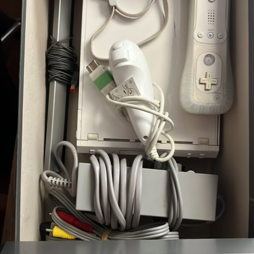 Nintendo Wii console with cables and one controller