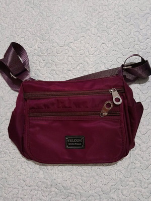 Crossbody bag like new, waterproof purple with multiple compartments