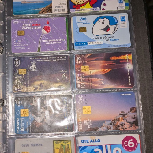 Black folder like new with 25 phone cards and cards
