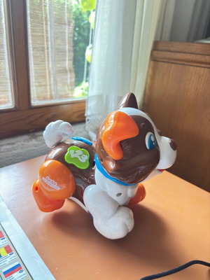 Colorful puppy toy on wheels designed by Clementini