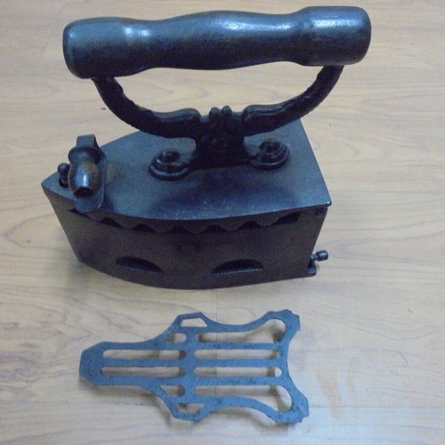 Antique charcoal iron restored with internal grill