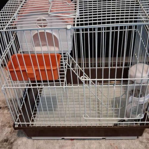 Hamster cage like new with two doors, house, feeder, and water bottle