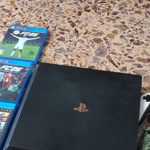 PS4 Pro console with 3 games and 2 controllers