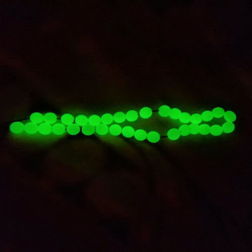 Plastic worry beads used that glow in the dark