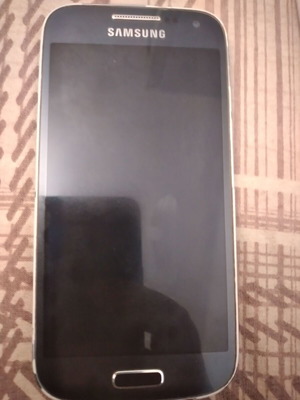 Samsung Mini phone used, for parts with charger