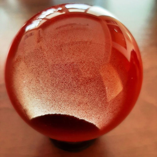 Indian crystal sphere red color on wooden base new