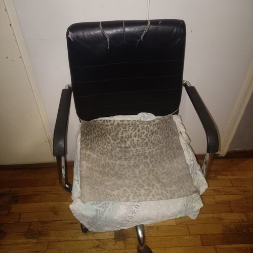 Office chair used, functional with armrests and wheels, repair needed