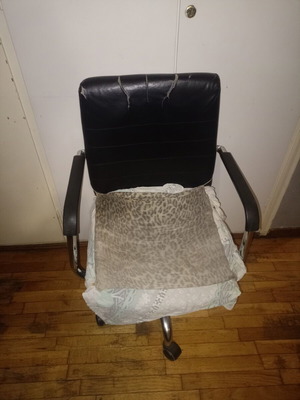 Office chair used, functional with armrests and wheels, repair needed