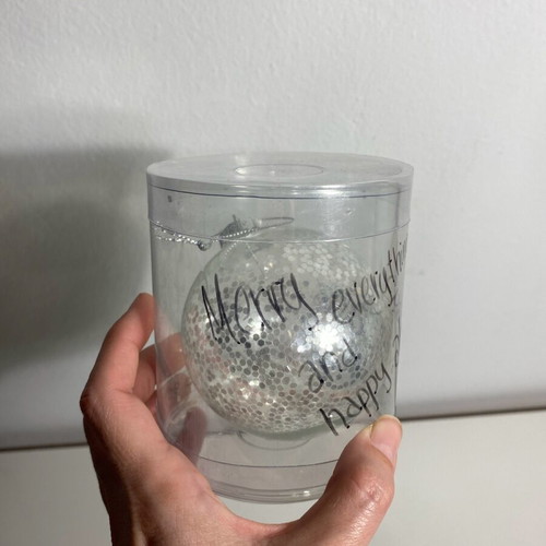 Christmas ball with silver glitter like new, transparent