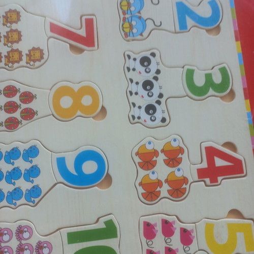 Children's book 'The Brave Dog' and wooden educational number puzzle