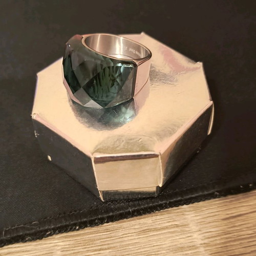 Steel ring used with green glass