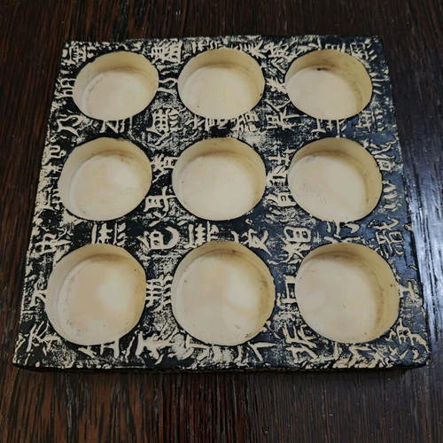 Stone base for 9 tealights like new with Asian designs