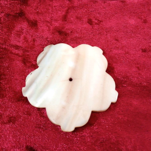 Carved coffee-yellow mother-of-pearl element with hole hibiscus shape