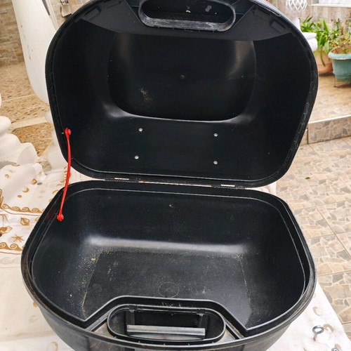 Large motorcycle top case used with key and passenger cushion