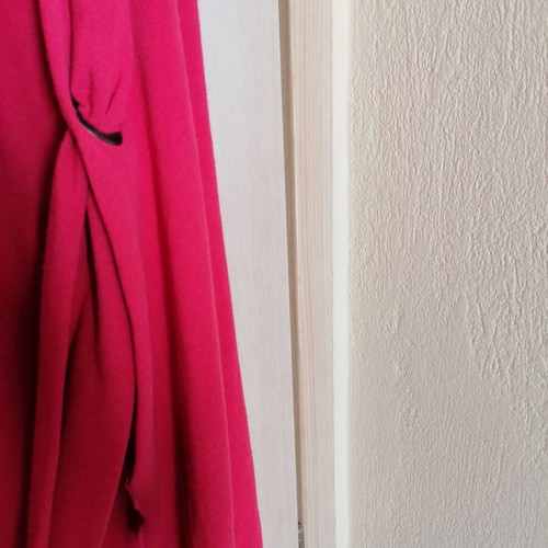 Cardigan new coral color with unique design and button fastening