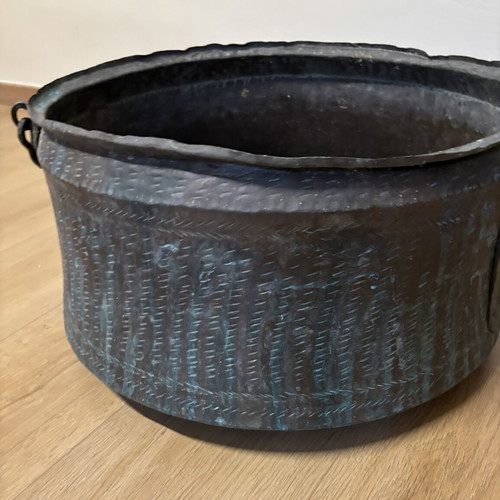 Vintage copper cauldron with hand-forged decoration used