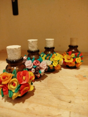 Handmade flowers in mini bottles set of 4 pieces