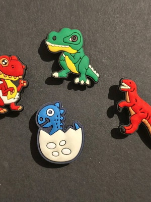 Crocs Charms Jibbitz Dinosaurs set like new, multicolored
