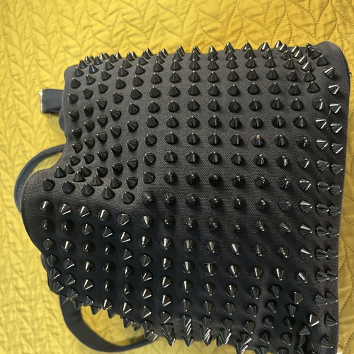 Black shoulder bag with studs used, spacious red lining
