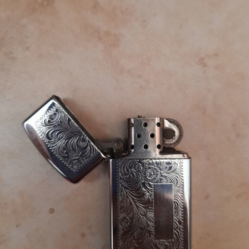 Zippo Venetian Slim Lighter like new, silver floral design
