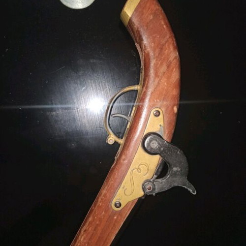 Decorative flintlock pistol used with vintage style