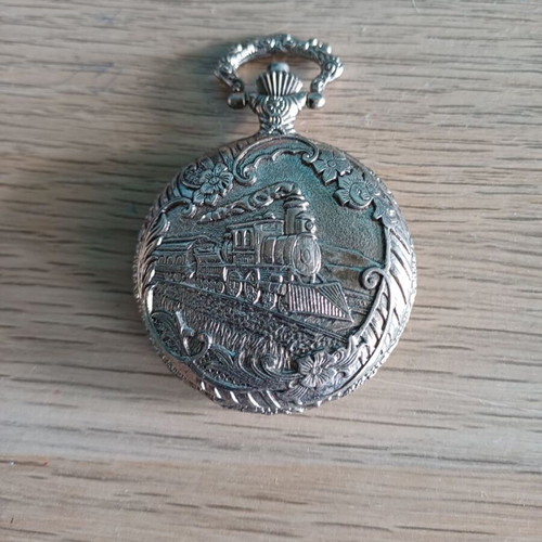 Old pocket watch like new with embossed pattern