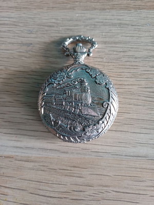 Old pocket watch like new with embossed pattern