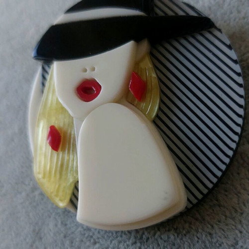 Large Plexiglass pin like new, multicolored with female face design