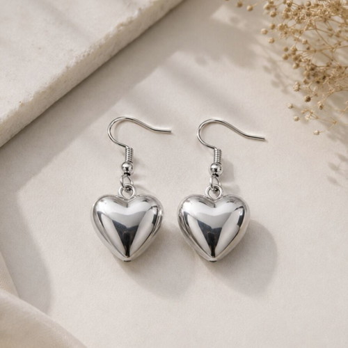 Heart design earrings in silver tone