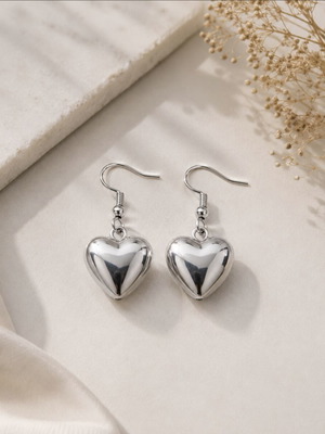Heart design earrings in silver tone