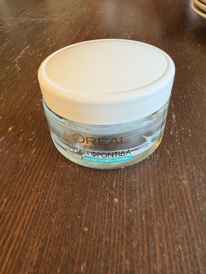 L’Oréal day cream bottle used, empty