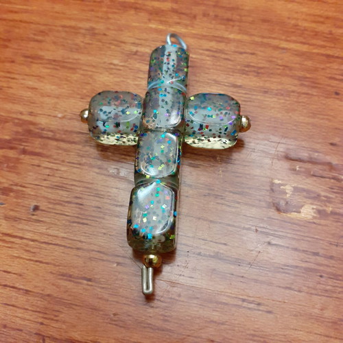 Cross large with glitter used, synthetic material