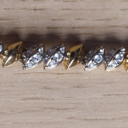 Swarovski bracelet like new, gold tone with crystals